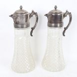 A large pair of silver plate-mounted moulded glass jugs, height 36cm