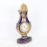 A replica Marie-Antoinette clock from the Victoria & Albert Museum, gilded blue glaze porcelain in