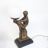 An Art Deco style bronzed resin figural dancer table lamp, with milk glass shade, height 46cm