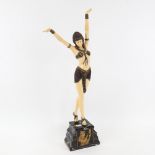 A composition figure of a 1920s style dancing girl, on plinth, 55.5cm