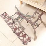 A pair of wrought-iron bench ends, and matching back panel