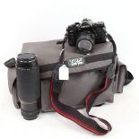 A Vintage Canon A-1 film camera, with various accessories, including Canon zoom lens 100-300mm,