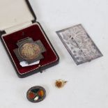 Unmarked Scottish silver and hardstone brooch, silver Good Conduct medal, and an abstract silver