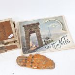 2 miniatures of the Nile, a book of photographic prints, and a painted wooden hand of Fatima