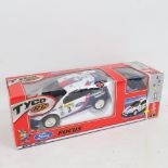 A Tyco remote control Ford Focus toy rally car, boxed