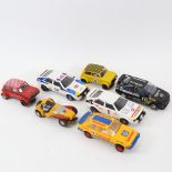 Various Scalextric toy cars, including advertising