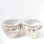 A pair of Chinese porcelain jardinieres decorated with butterflies, height 24cm