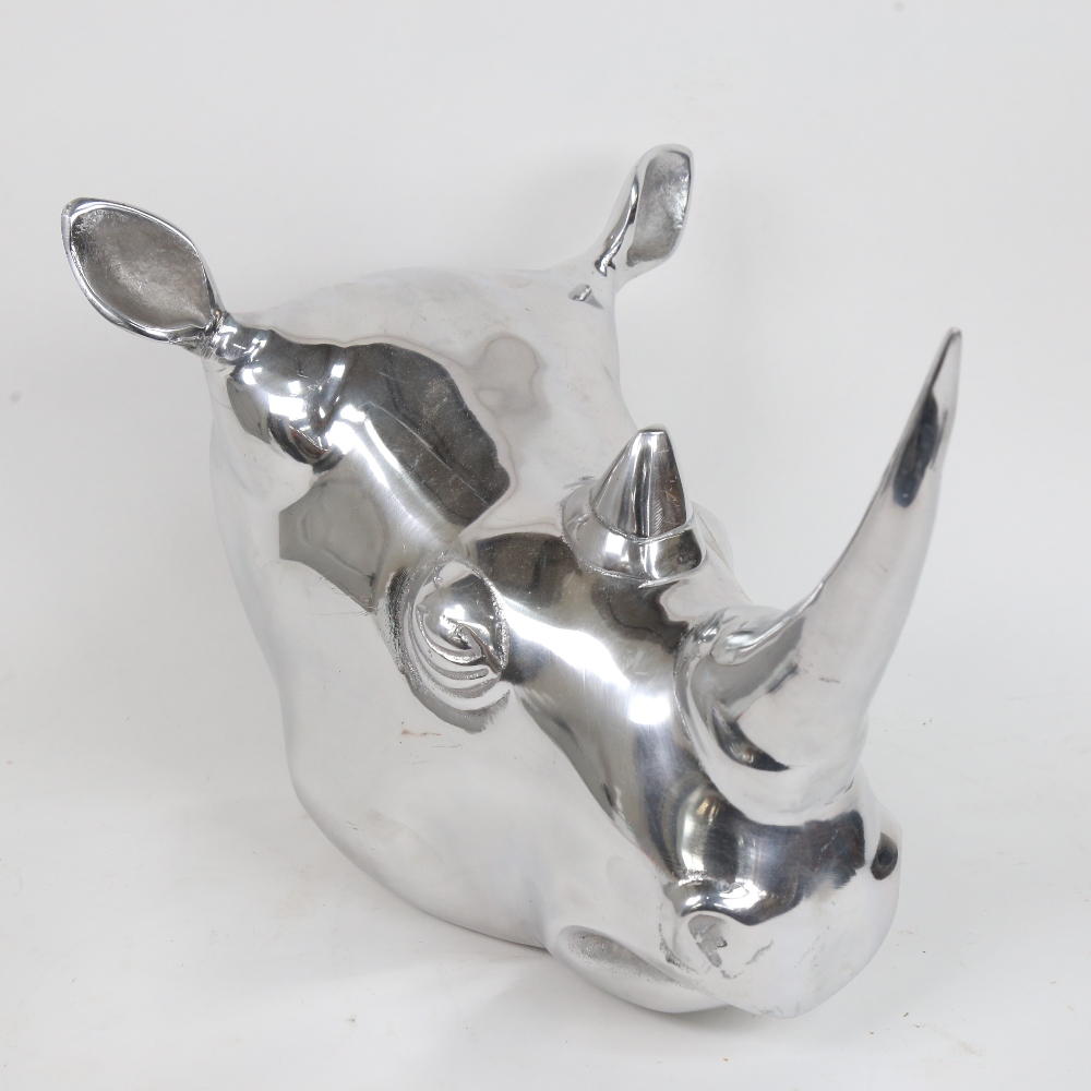 A modern chrome wall-hanging rhinoceros-head sculpture, length 34cm