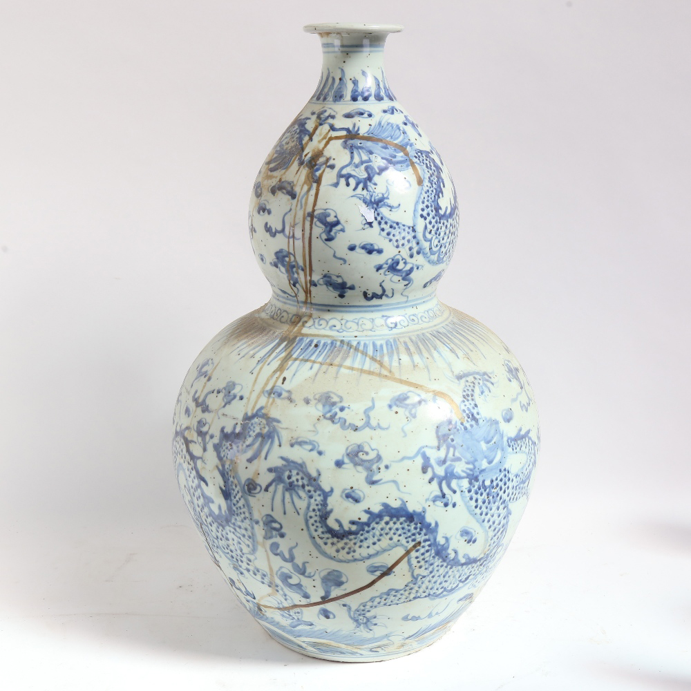 A large Chinese blue and white 'dragon' double-gourd vase, height 65cm