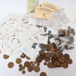 A quantity of various British and world coins, and Stanley Gibbons coin protectors