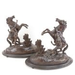 A pair of spelter Marley horse groups, base length 37cm, height 34cm