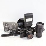 A Canon A-1 camera, with lens etc