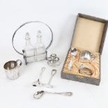 A silver-mounted inkwell, a Continental silver spoon and pusher, oil jar set in plated stand, and