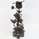 A large patinated cast and wrought-metal flower sculpture, unsigned, height 54cm