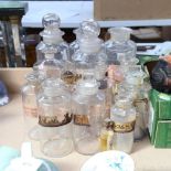 A group of Vintage apothecary glass jars and covers, some with original labels