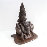 A Black Forest carved wood wall bracket, supported by 3 birds, height 46cm