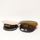 2 military caps, including 1990/91 Gulf War Kuwait Officer's cap, and Merchant Navy Captain's cap (