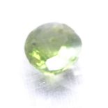 A 2.21ct unmounted oval mixed-cut peridot, dimensions: 9.62mm x 7.51mm x 4.66mm, with ITLGR Gemstone