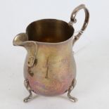 An Elizabeth II silver cream jug, maker's marks JW Ltd, hallmarks London 1977, height 9cm, 3oz