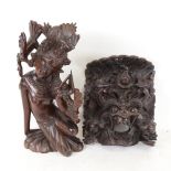 A carved hardwood Eastern dancer, 30.5cm, and a carved hardwood wall ornament