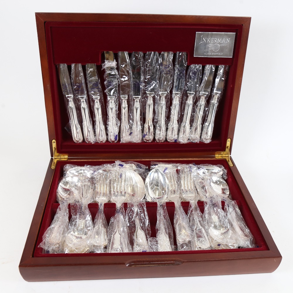 An unused Inkerman Fiddle Thread and Shell pattern silver plated canteen of cutlery for 6 people, in