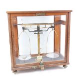 A Vintage cased set of laboratory balance scales, W42cm, H43cm