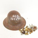 A First World War Period steel Brodie helmet, and various military buttons and badges
