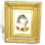 A Victorian print on opalescent glass, portrait of a child, in original gilt frame, overall frame