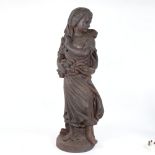 A large and heavy cast-iron figural sculpture, lady carrying logs, unsigned, height 68cm