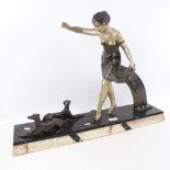A large French Art Deco spelter sculpture, lady with 2 Greyhounds, on angular veined marble base,