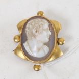 A 19th century unmarked yellow metal relief carved hardstone cameo brooch, possible depicting
