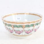 A Chinese fluted porcelain bowl, with painted floral decoration, signed, 23cm across