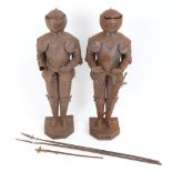 A pair of tin table-top suits of armour, height 40cm