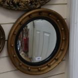 A gilt framed convex wall mirror, overall diameter 44cm