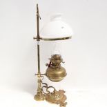 A Messenger's no. 2 brass rise and fall oil lamp, with milk glass shade and clear funnel, column