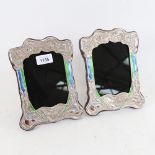 A pair of Art Nouveau style Continental silver and enamel-fronted strut photo frames, overall height