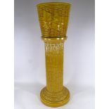 A Victorian Majolica basket weave design jardiniere, with ribbon decoration, height 31cm, on similar