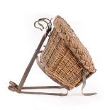 A 19th century wrought-iron framed wicker metamorphic child's bicycle seat, iron frame height 44cm