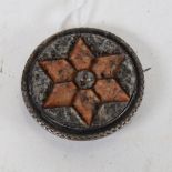 An unmarked silver Scottish hardstone Tage shield panel brooch, diameter 4.5cm, 19g