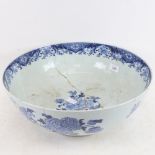 A large Chinese blue and white wash bowl, floral decoration, diameter 40cm (A/F)
