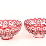 A pair of Bohemian cranberry overlay cut-glass fruit bowls, diameter 24cm