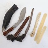 A kukri knife and sheath, horn-mounted kris, Nordic? carved bone knife etc