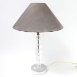 A modern table lamp, with acrylic column and polished steel plinth, 55cm