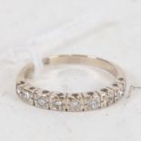 A late 20th century 18ct white gold diamond half eternity ring, size N, 3g