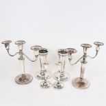 A pair of 2-branch silver plate on copper candlesticks, a pair of plated candlesticks, and a pair of