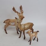 A Beswick porcelain deer family, largest height 20cm (3)