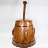 A Vintage stained pine apple press with plunger