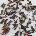 A collection of Vintage lead soldiers, cowboys, and other figures