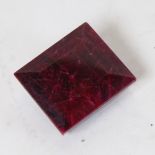 A 433ct unmounted square-cut ruby, dimensions: 41.00mm x 36.00mm x 21.00mm, evidence of colour