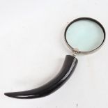 A large novelty horn-handled magnifying glass, glass diameter 15cm